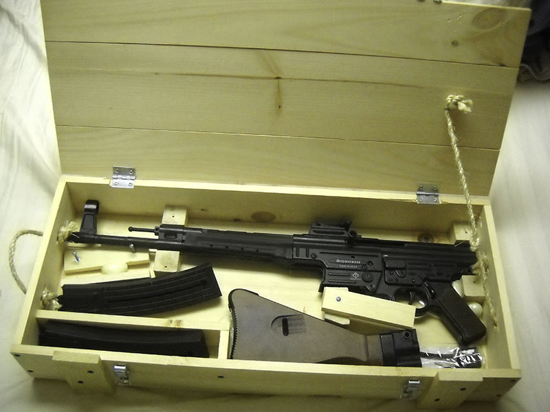 (a lovely wooden crate with a partially dismantled rifle in it)
